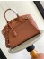Louis Vuitton Lock It MM Bag in Taurillon Leather M22925