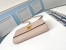 Louis Vuitton Lockme Clutch In Greige Calfskin M56087