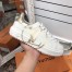 Louis Vuitton White Time Out Sneakers with Gold LV Circle